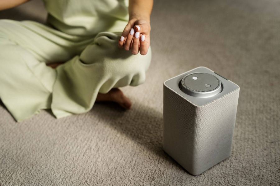 Audio enthusiast adjusting subwoofer crossover settings on an AV receiver to create the best home sound system for music with seamless speaker and bass integration.